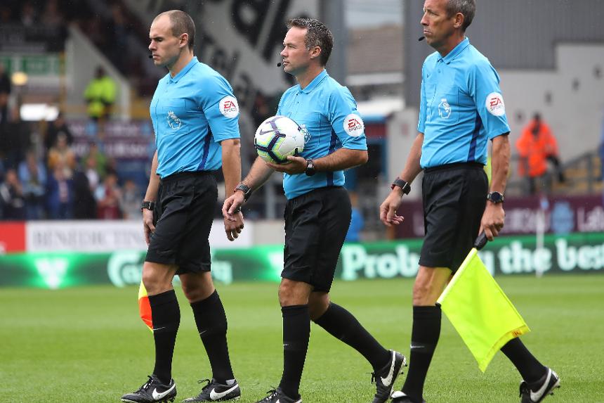 Referee Paul Tierney and assistant referee's Adrian Holmes and Michael McDonough